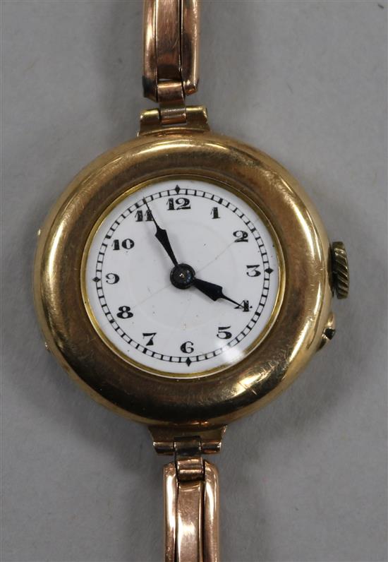 A ladys early 20th century 9ct gold wrist watch on 9ct gold bracelet.